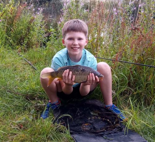 Brickyard Fishery-young-boy-with-fish1